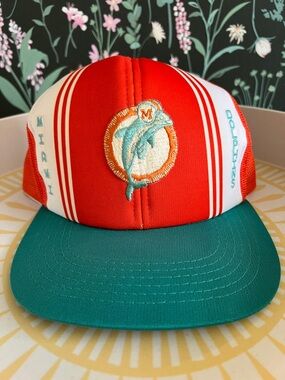 VINTAGE 1980s Miami Dolphins "Lucky Stripes" trucker hat featuring a mesh back